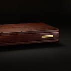 The <b>BlackGround 10x Speaker Base</b> features a hand sanded, lacquered wooden enclosure. For stereo two channel applications, two such units are required, one for each channel.