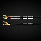 C-MARC™ loudspeaker cables provide what we consider the ultimate connection between power amplifiers and loudspeakers. Shown above is one channel, made up of two separate polarities, one marked red, the other marked black. A directionality arrow is provided so that the cable can always be connected in the same direction. This is important so that its long term developed maturity of tone can be maintained when switching amps, speakers or systems.