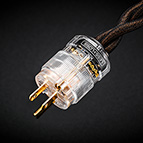 The State-of-the-Art C-MARC™ <i>Entropic Process</i> power cable can be ordered with the wall plug option to fit your country's standard. Pictured above is the NEMA 5-15 (North American 15 A/125 V grounded) with <i>Entropic Process</i> insignia attached to the internal wall of the transparent housing. It is non-removable.