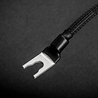 Here you can see the C-MARC™ Grounding Cable terminated with the Large Spade option. This is a Xhadow brand spade, used for loudspeaker cables. This Large Spade is unsuitable for use with the Blackbody, but on other equipment which has a special grounding terminal, it may be a perfect match. Dimensions of this Large Spade option are described in a graphic on this web page.